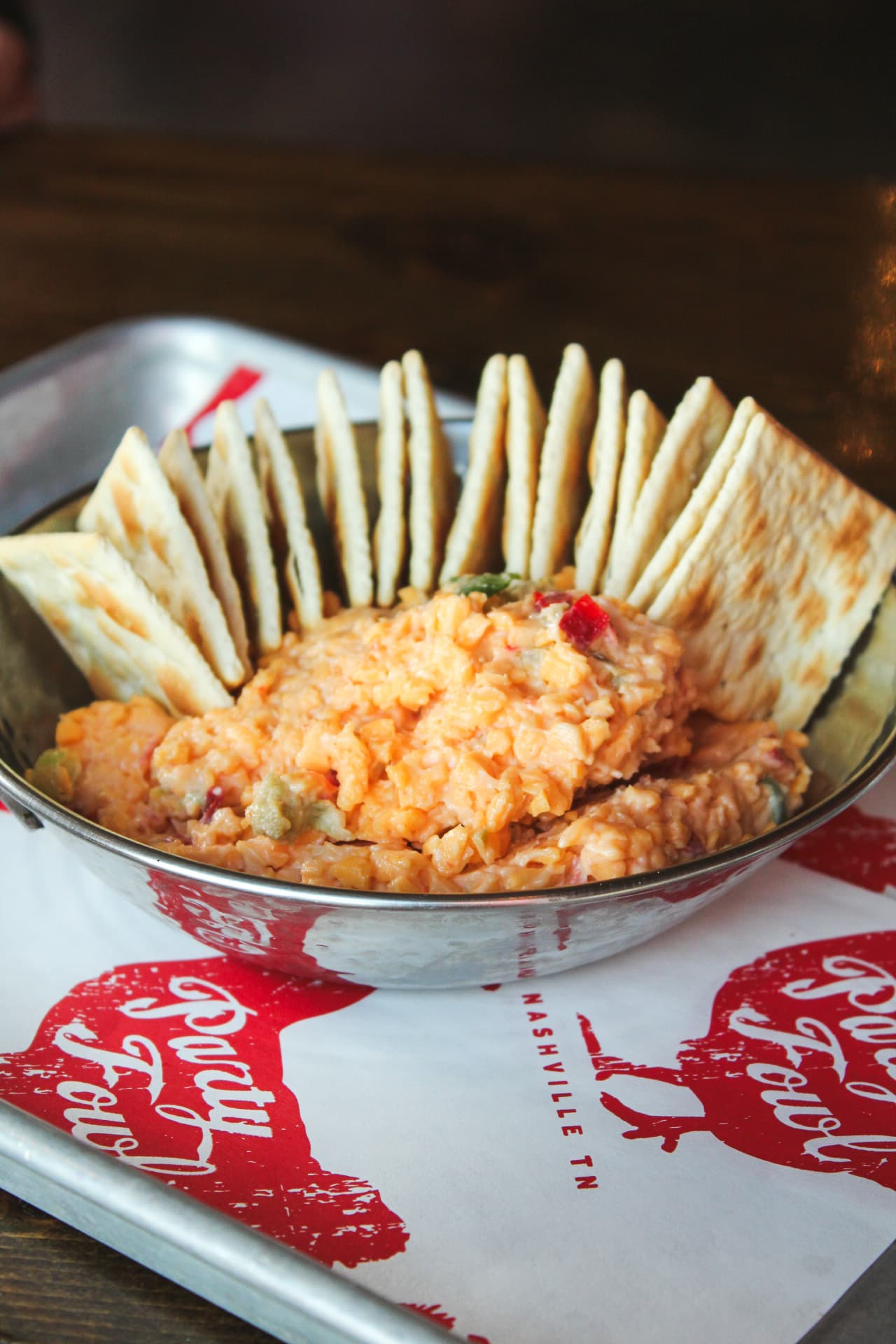 Homemade Pimento Cheese A bowl of creamy pimento cheese surrounded by crackers